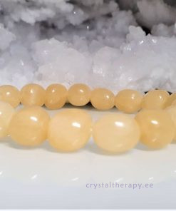 Kaltsiit, kollane ja oranž käevõru